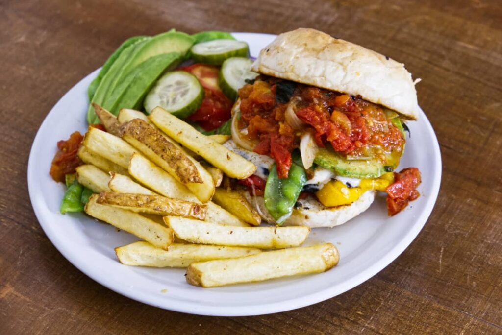 The vegetarian burger at El Quinque Restaurant in Oaxaca, loaded with vegetables and a side of french fries.