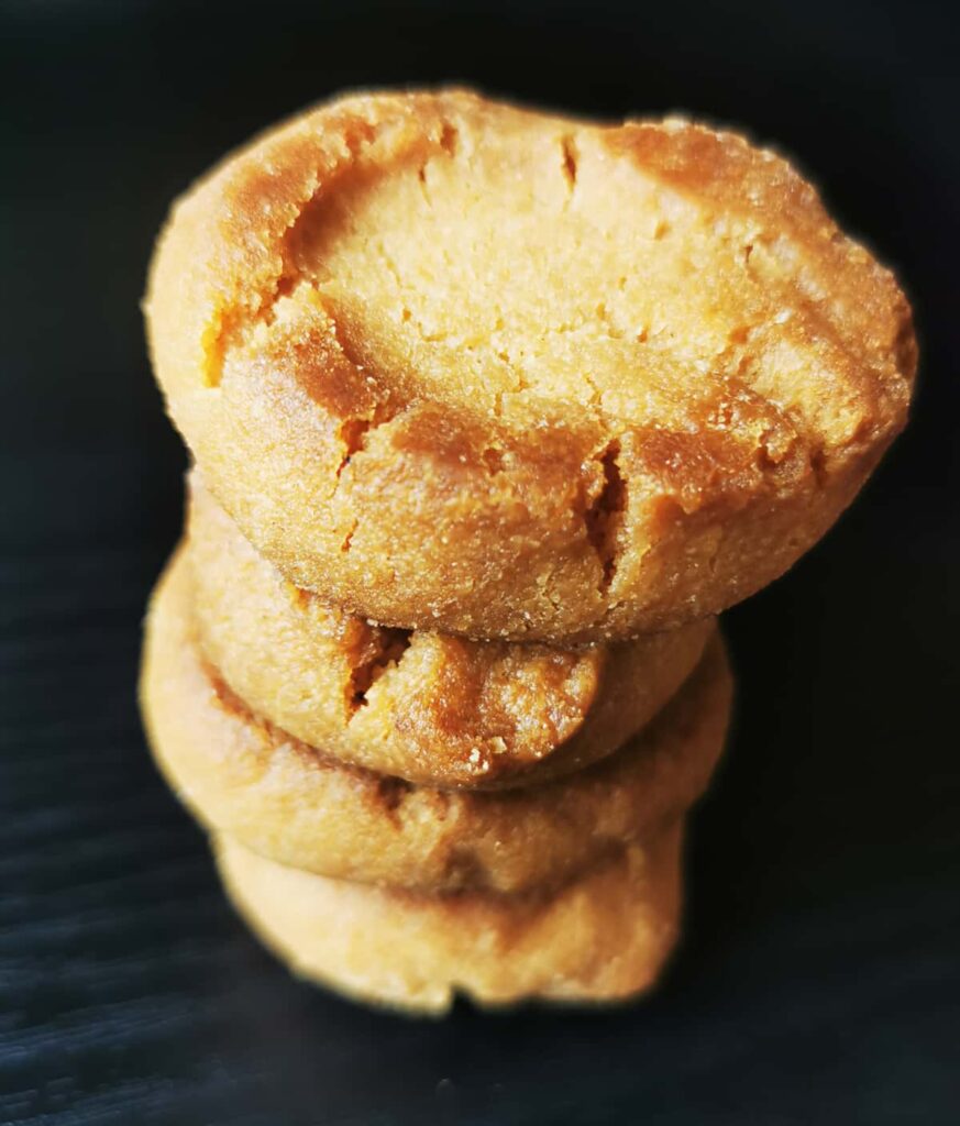 A stack of small yellowish cookies called nenguanitos, a traditional Oaxacan sweet.