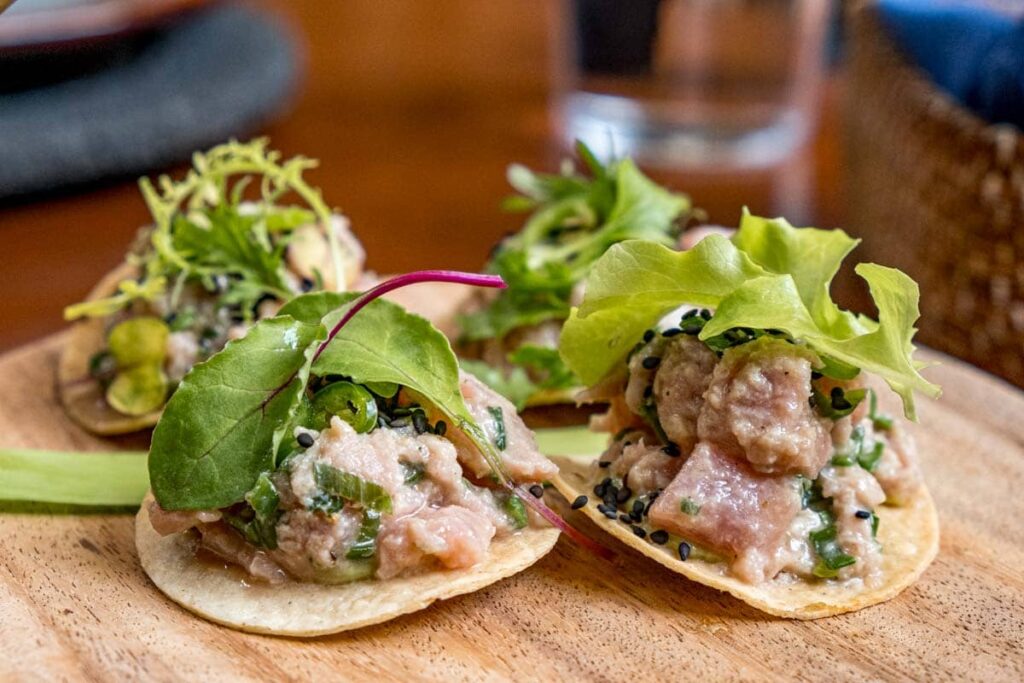 Mini tuna tostadas at Los Danzantes restaurant in Oaxaca topped with baby greens.